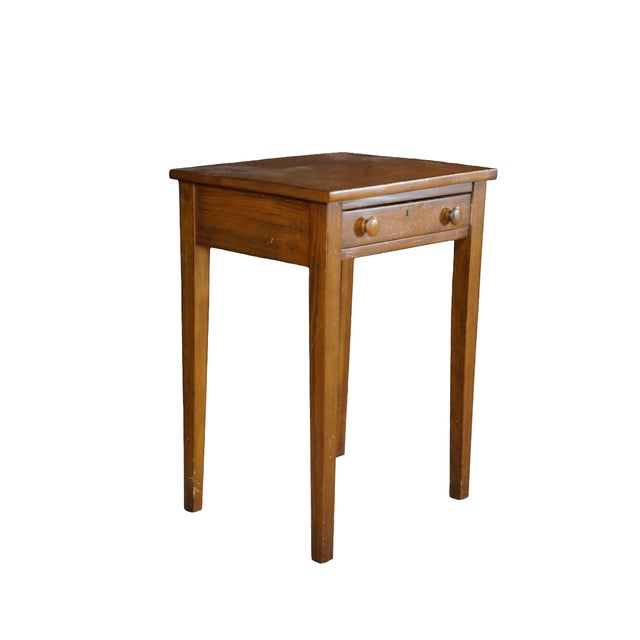 This early 1900s antique side table is a classic example of early American Federal or Sheraton style design, crafted from...