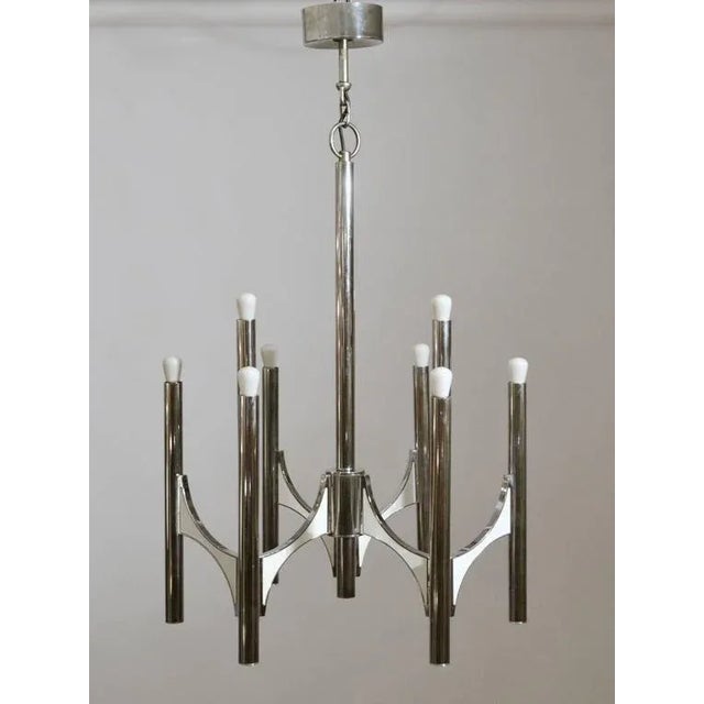 Chrome chandelier with creme enamel details, by Sciolari, Italy 1960s. Dimensions: Width 50 cm. Total height 88 cm. Up to...