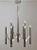 Chrome chandelier with creme enamel details, by Sciolari, Italy 1960s. Dimensions: Width 50 cm. Total height 88 cm. Up to...