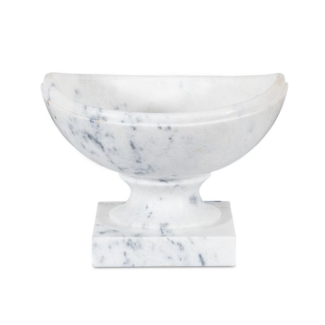 Graceful and architectural, the crescent vase reinterprets an ancient form with sculptural balance. Its sweeping, upturned...