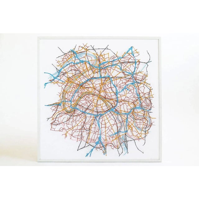 Materials include duralar, enamel paint and pins.