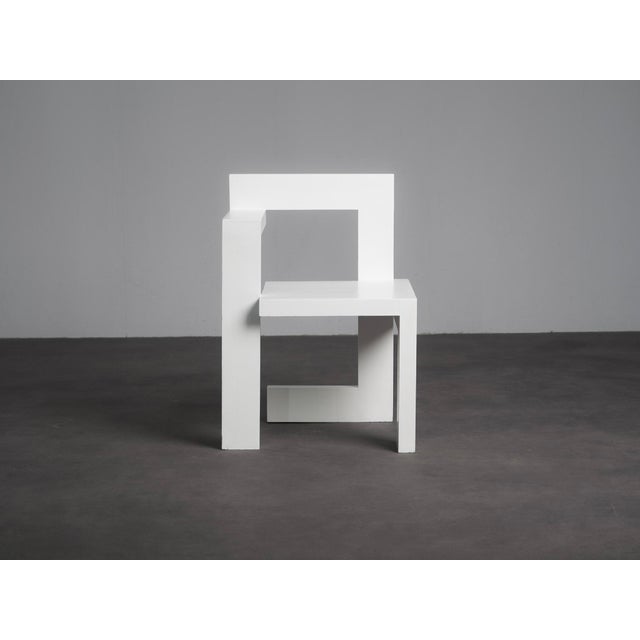 A distinctive asymmetrical wooden chair from the netherlands, dating from the 1970s. The design is clearly inspired by...