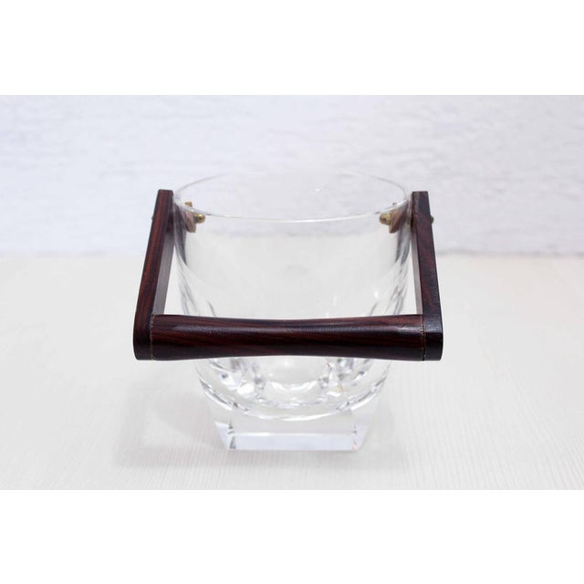 Mid century crystal ice bucket with wooden handle. Serve the aperitif elegantly with this beautiful ice bucket from the...