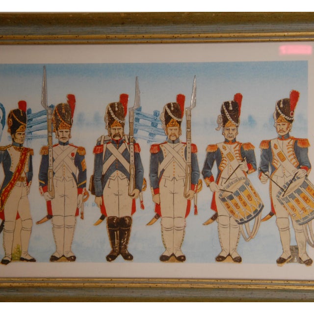 A refined vintage set of a framed collage of lithographs depicting Napoleonic French Imperial Army uniforms and military...
