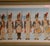 A refined vintage set of a framed collage of lithographs depicting Napoleonic French Imperial Army uniforms and military...