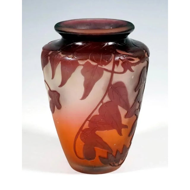 Flush foot, raised, widening body with a shoulder-shaped narrowing at the top, with a short, wide neck and flared, rounded...