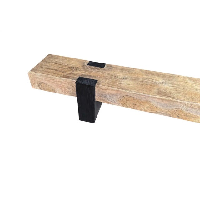 This hand-crafted bench celebrates the enduring beauty of reclaimed teak through a thoughtful dialogue of finishes and...