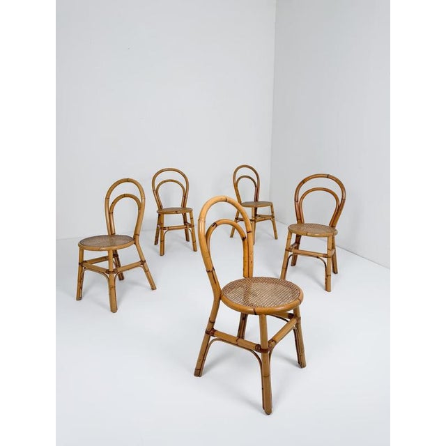 This elegant set of five Italian Mid-Century Modern dining chairs, crafted in Italy during the mid-20th century,...