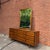 Long walnut lowboy dresser by American of Martinsville with nine drawers and original mirror. Features softly beveled...