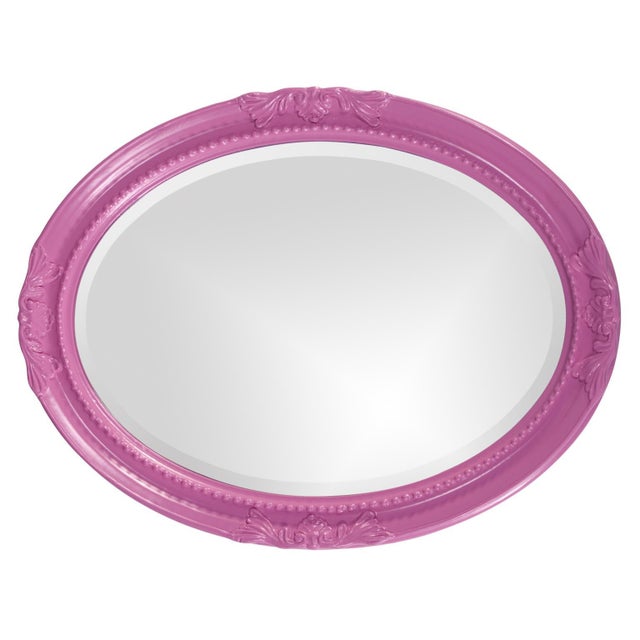 The Queen Ann Mirror features a glossy hot pink lacquer finish. The oval frame is made from wood and is accented with a...