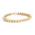 A luminous strand of rounded dome beads glides around the wrist like liquid sunlight, each high‑polish link reflecting a...