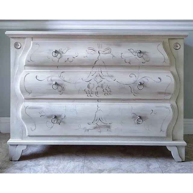 Inspired by French Provncial designs with ornate carvings of rococo style, this chest is made by Ethan Allen in the Maison...
