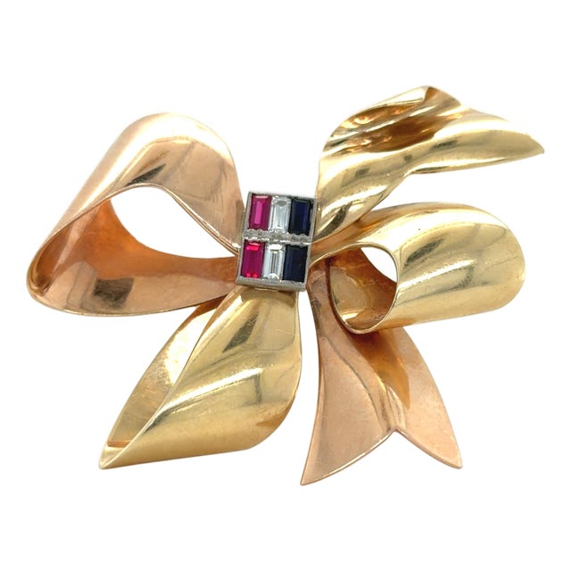 1940s Tiffany & Co. Retro 14k Bicolor Gold Ruby, Diamond and Sapphire Bow Brooch For Sale
