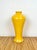Vintage chinoiserie yellow ceramic vase. Elegant tall silhouette in rich marigold yellow glaze.