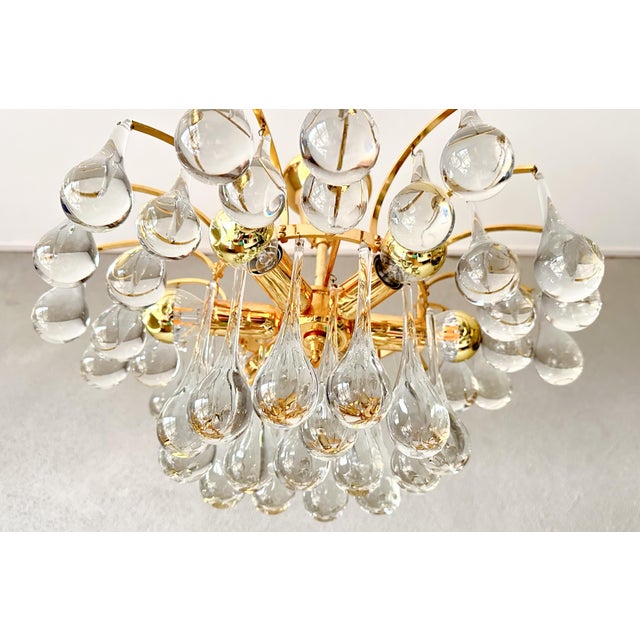 Beautiful mid-century design. Pendant lamp from the 1970s, made by the German company Christoph Palme. Brass base with...