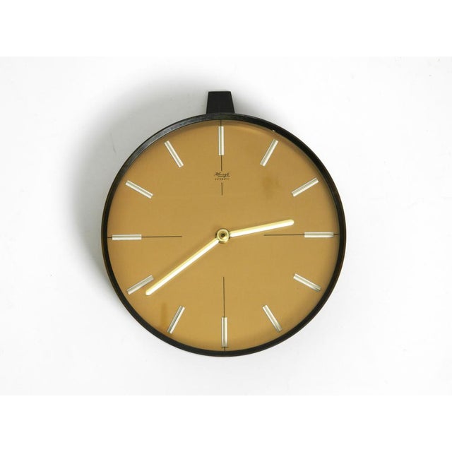Beautiful, very elegant and ​​heavy 1960s Kienzle wall clock made of bronze and brass. Made in Germany. Very nice,...