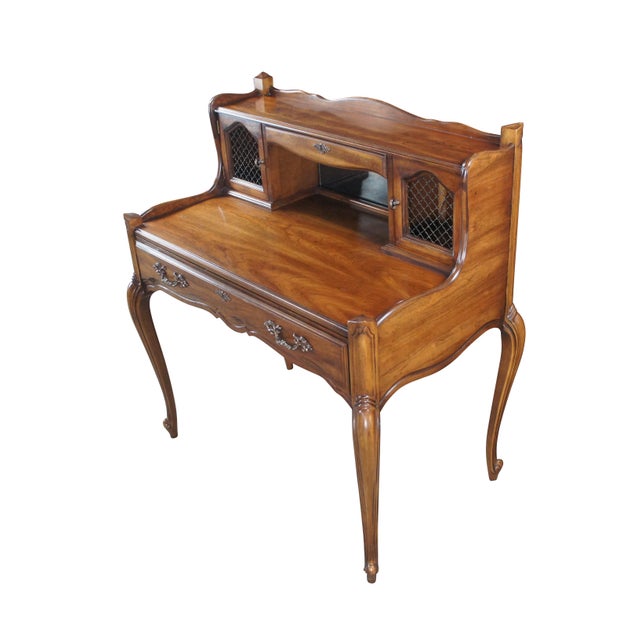 Vintage National Mt Airy French Louis XV writing desk. Made of walnut featuring a scalloped serpentine design with large...