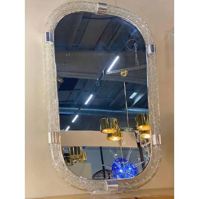 Scenographic wall mirror in murano glass full of silver brass and transaprent frame solid detail in silver brass. A luxury...