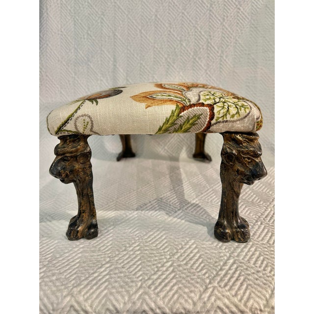 This petite footstool is perfect for tucking under a chair, pull it out when resting your feet. This particular piece has...