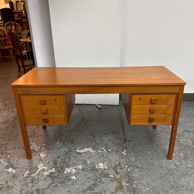 Design Plus Gallery presents a Mid-Century Danish Modern Double Pedestal Desk by Domino Mobler. The classic Scandinavian...