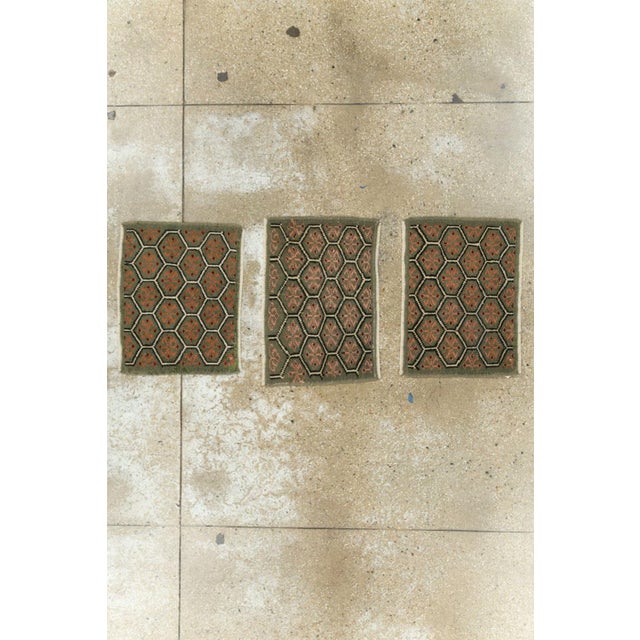 This group of three mid-20th-century Turkish Anatolian rugs features a closely related geometric design rendered in soft,...