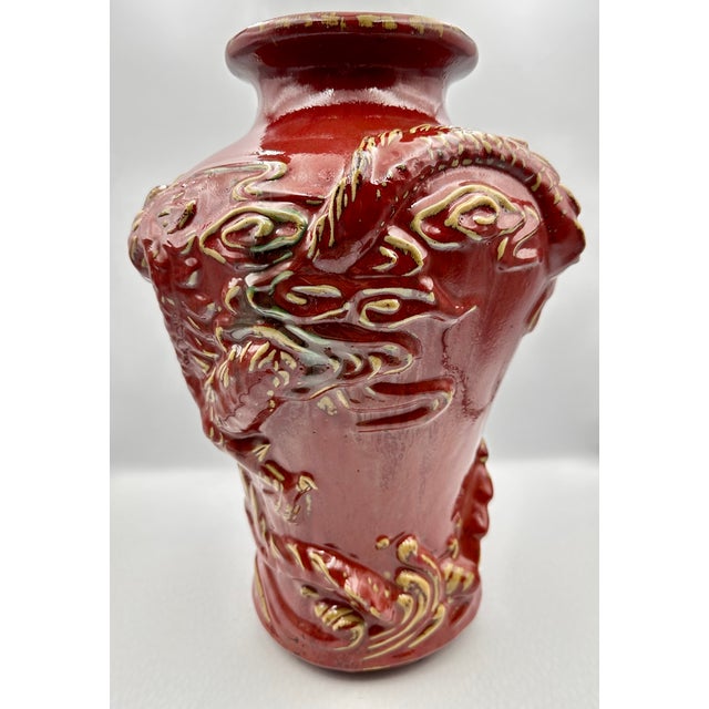 This stunning vintage Chinese vase features a mesmerizing Sang de Boeuf, or oxblood glaze, a coveted finish known for its...