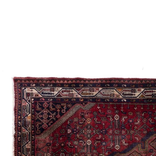 Asian rug (253 cm). 20th-century Asian rug in wool and cotton; decorated with floral motifs; stylized geometric patterns...