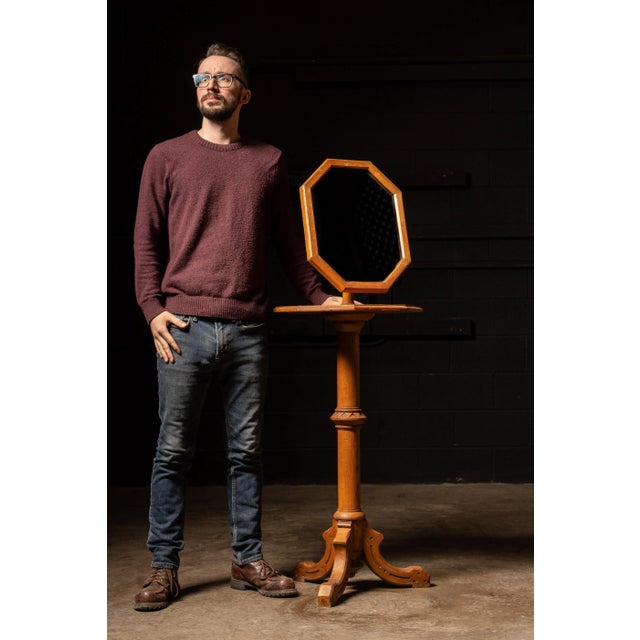 Antique floor length shaving mirror with adjustable head. This piece features quarter sawn oak construction and an...