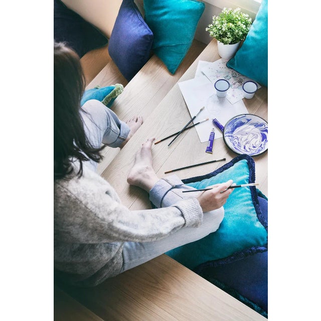 The Happy Pillow in blue night is part of a collection from Lo Decor of soft velvet cushions with a fringe.