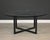 A mid century round dining table or patio table with a glass top. Glass has some scratches but no chips. One dimple shown....
