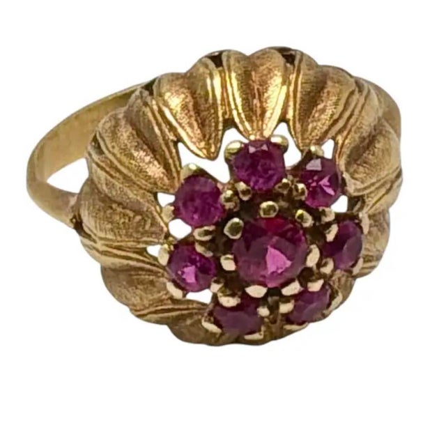 Vintage 14K Yellow Gold and Ruby Cluster Cocktail Ring. Ring features a slightly larger central ruby encircled with eight...