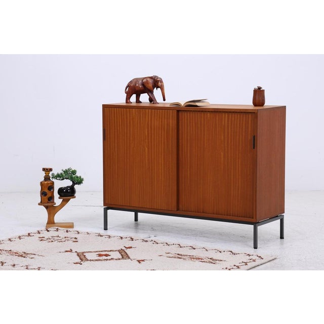 Product details beautiful mid-century chest of drawers with sliding doors item no.: 260324 features • period: 1960s •...