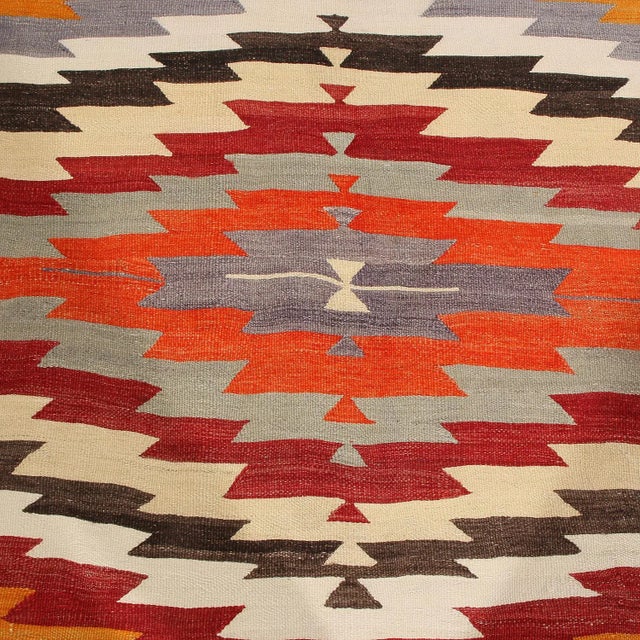 Flat-Woven By Hand In High-Quality Wool Originating From Turkey Between 1940-1950, This Vintage Geometric Kilim Rug Has A...
