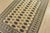 A tribal Bokhara rug hand-knotted with fine wool on a cotton foundation. This rug features rows of repeating medallions...