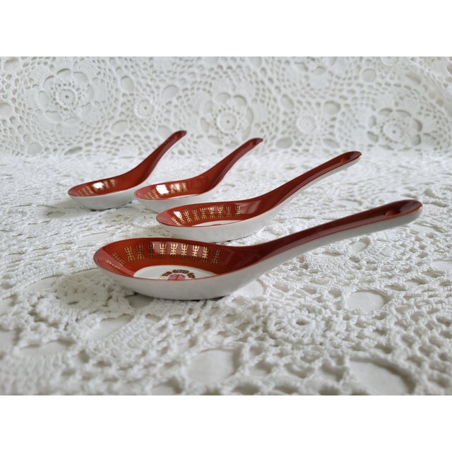 Set of 4 porcelain ramen soup spoons. Marked "made in Taiwan' and measuring 5 1/2" x 1 3/4" x 1/2". A beautiful set in...