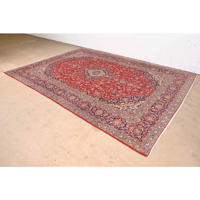A gorgeous vintage hand-knotted room size Persian Kashan wool area rug 20th Century Beautiful traditional floral design,...