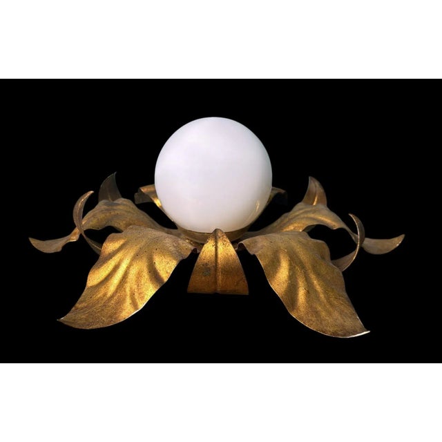 Elegant flush mount light, suitable for ceiling or wall installation, crafted in Italy during the 1950s. It features a...