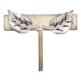 Vintage 1960 Signed Crown Trifari Rhodium Plated Clear Rhinestone Curled Leaf Clip Earrings-2 Pieces For Sale