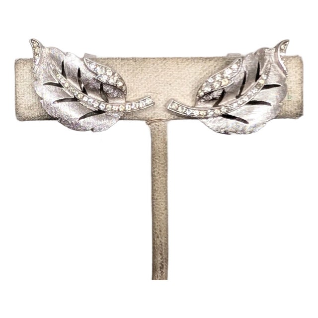 Vintage 1960 Signed Crown Trifari Rhodium Plated Clear Rhinestone Curled Leaf Clip Earrings-2 Pieces For Sale