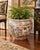 A beautifully decorated Chinese famille rose porcelain fishbowl planter featuring an elaborate composition of traditional...