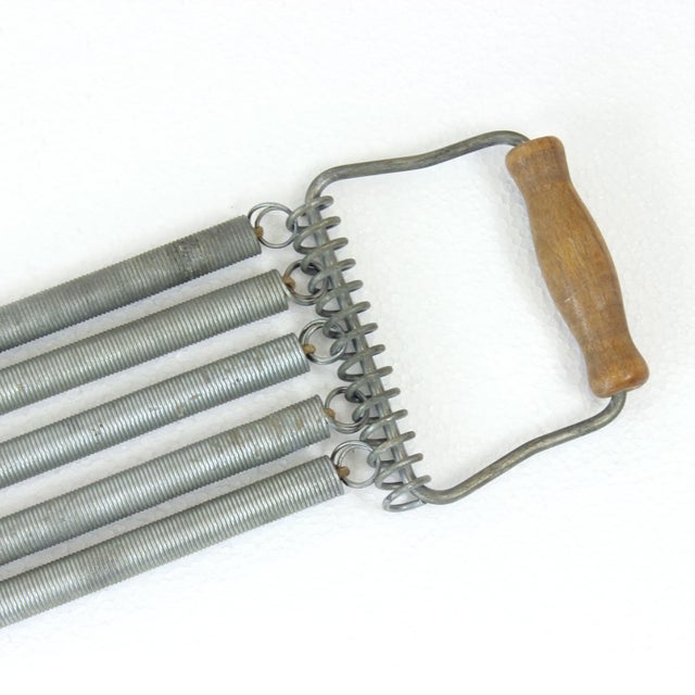 An iconic piece of vintage fitness equipment, this spring chest expander was a familiar staple in many households during...