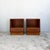 Each cabinet has an open storage compartment above a single drawer, fitted with the sculpted solid teak handle...