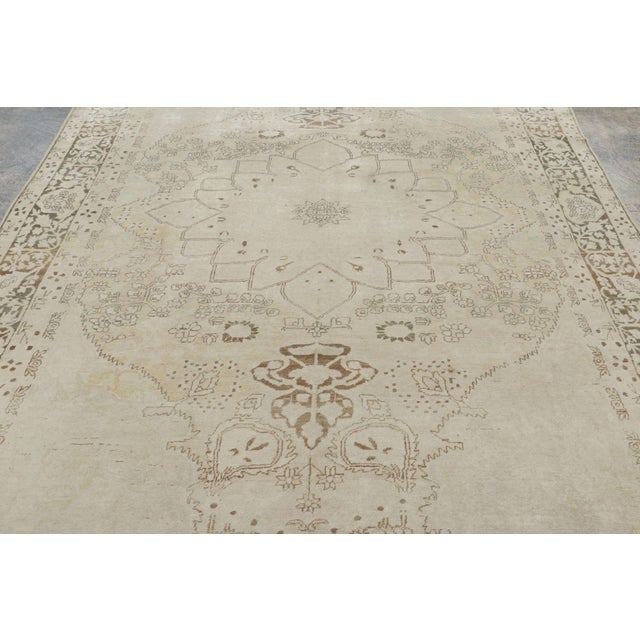 This 8x11 antique Persian Kerman rug, circa 1900–1920, is a distinguished new arrival to Rug & Kilim’s antique collection,...