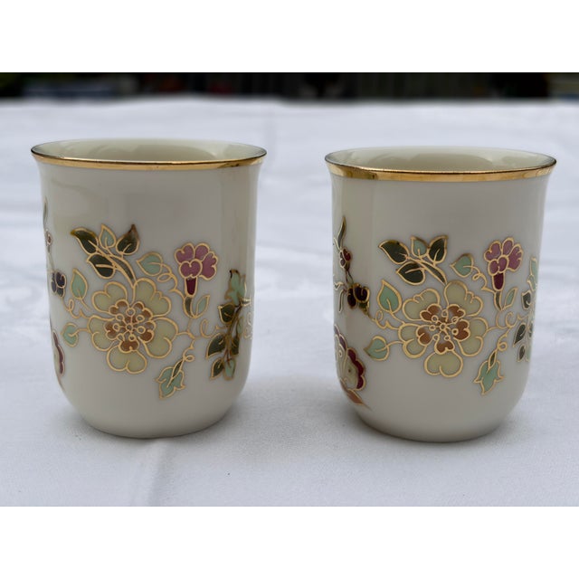 A beautiful, authentic pair of vintage Hungarian fine porcelain sake or liqueur cups produced by the renowned Zsolnay...