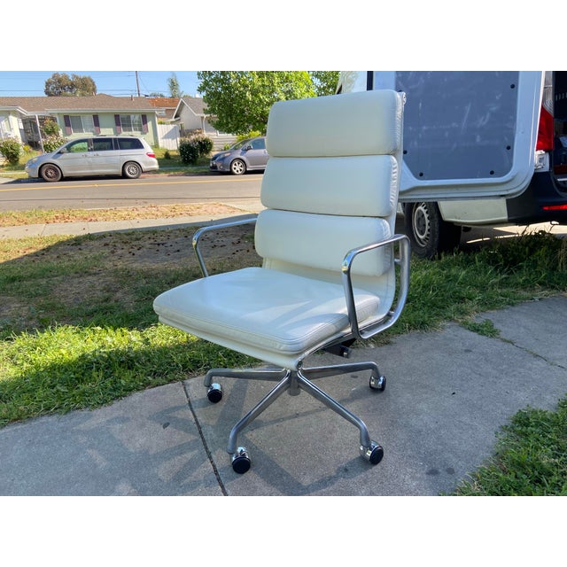 The Authentic Eames Soft Pad Chair - Executive by Herman Miller in White Leather is a high-quality office desk chair...