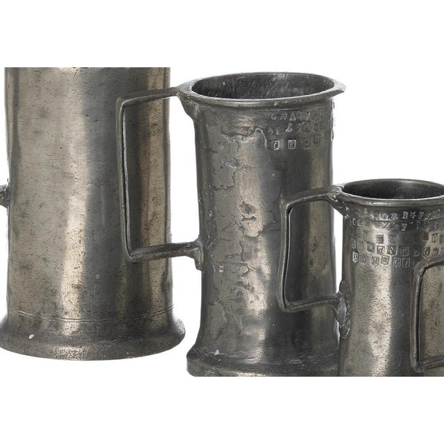 Set of five measures - 19th century. French; 19th century pewter; manufacture attributed to 'l. Brenu r. Cie - paris and...