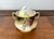 An exquisite three-piece antique Bavarian porcelain dessert or breakfast set featuring a striking, hand-painted grape and...