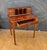 Elegant Louis XVI-style writing desk dating to the Mid-20th century. The desk features a rectangular writing surface above...