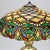 Arts & Crafts Leaded Stained Glass Table Lamp 20thC. Measures - 21.75"H x 16.25"W x 16.25"D. An Arts & Crafts table lamp...