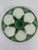 A striking antique French Faience Longchamp glazed majolica oyster plate with a vibrant green basket weave background and...